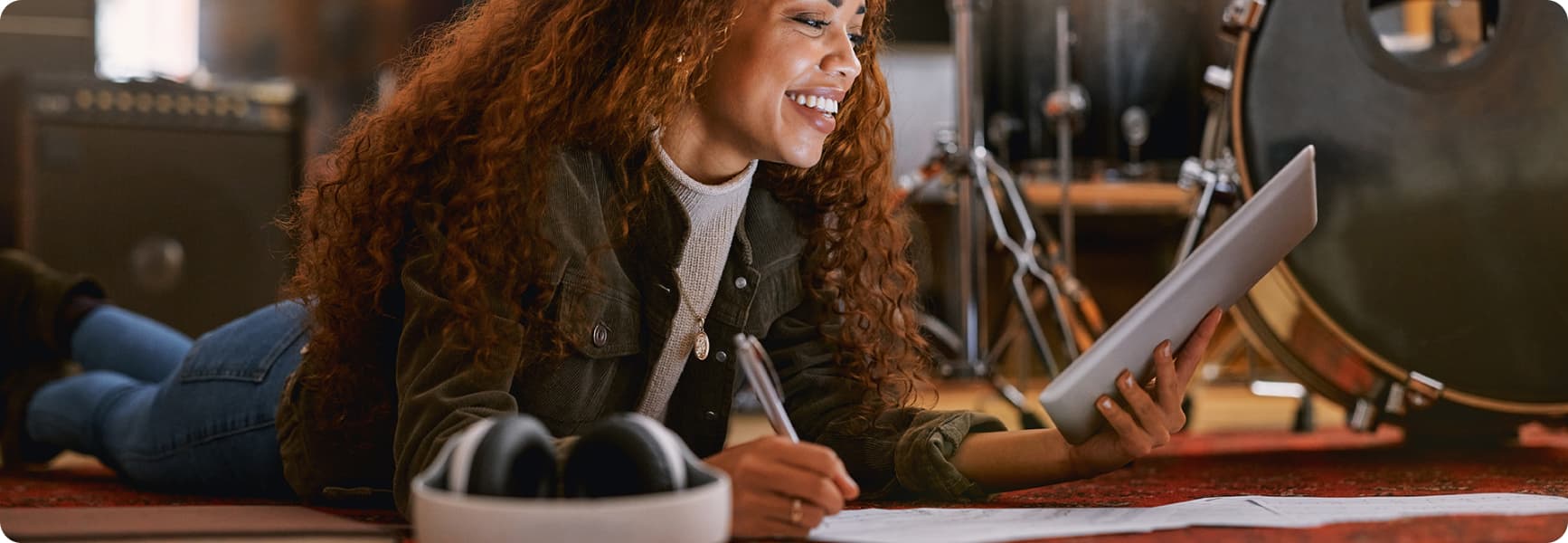 image of a girl reading smiling. working with a tab